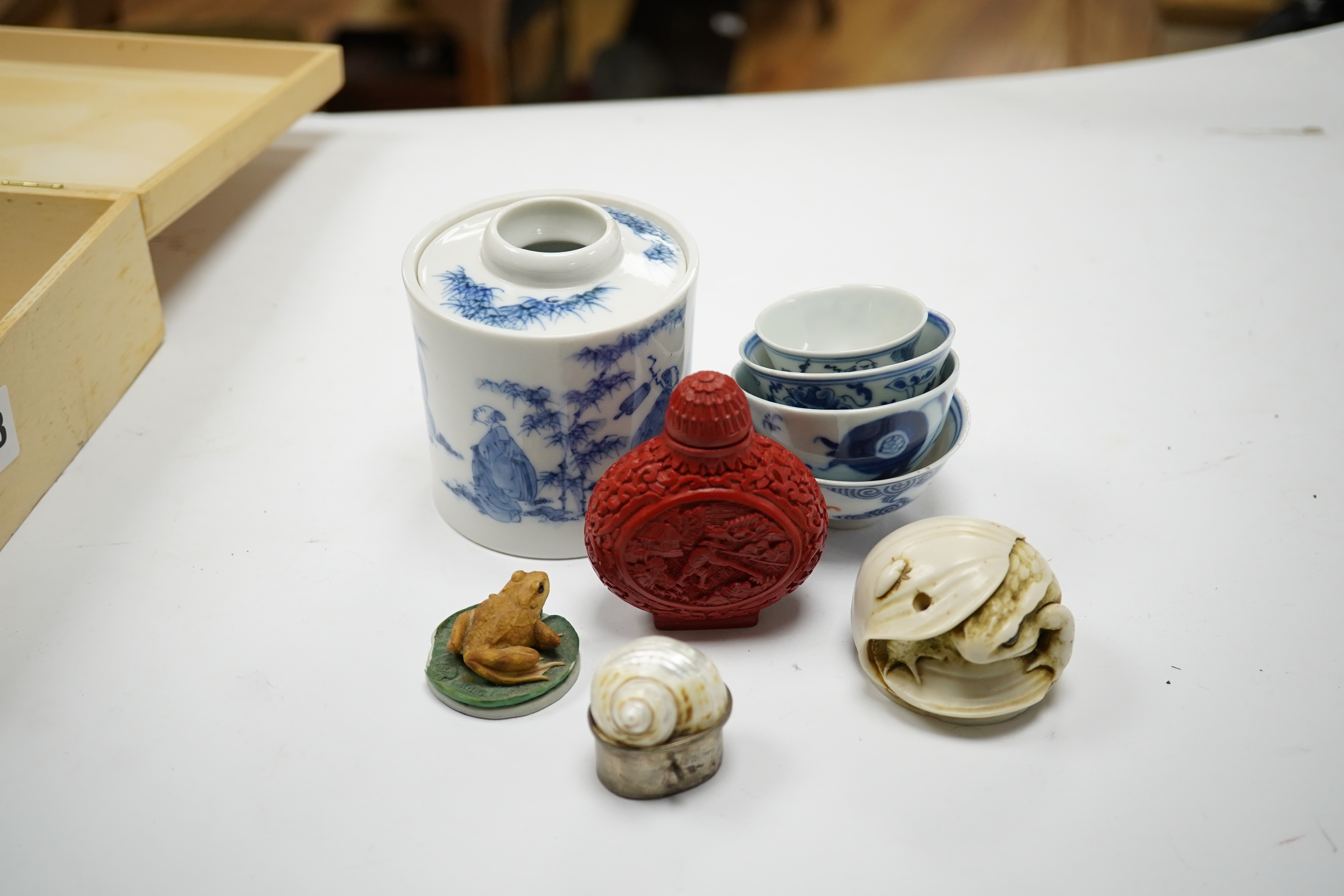 A Japanese blue and white seven sages of the bamboo grove joss-stick holder, 9.5cm high, four Chinese blue and white bowls, 19th/20th century and four other miscellaneous items. Condition - fair to good